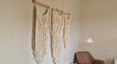Elegant macrame wall art at Wild Aura Denny, Denny, Scotland, GB, adding a calming touch to the wellness space.