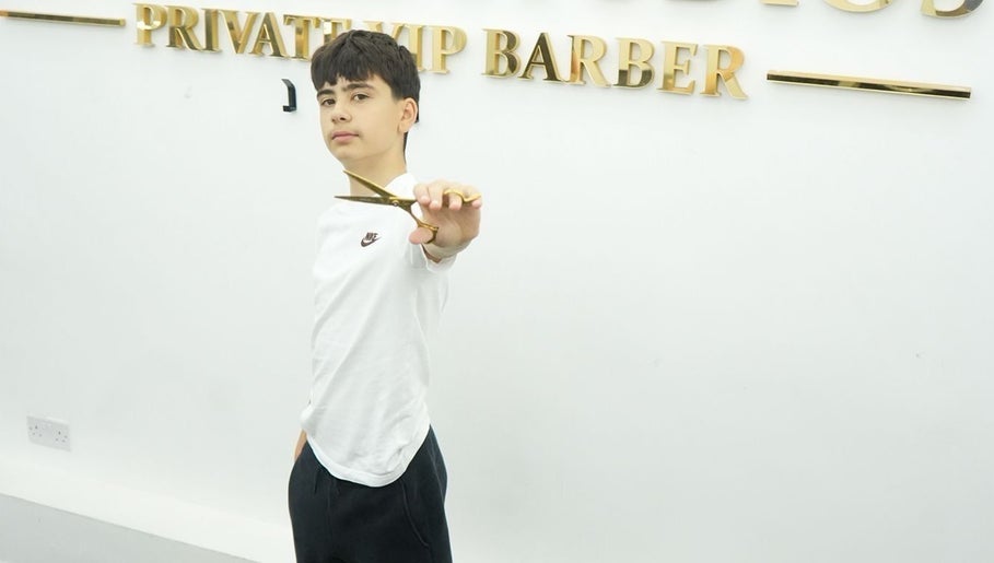 Young barber showcasing scissors at MertzBlendz, London, England, GB.
