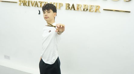Young barber showcasing scissors at MertzBlendz, London, England, GB.