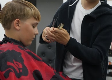 Professional haircut at MertzBlendz, London, England, GB depicting precision and style.
