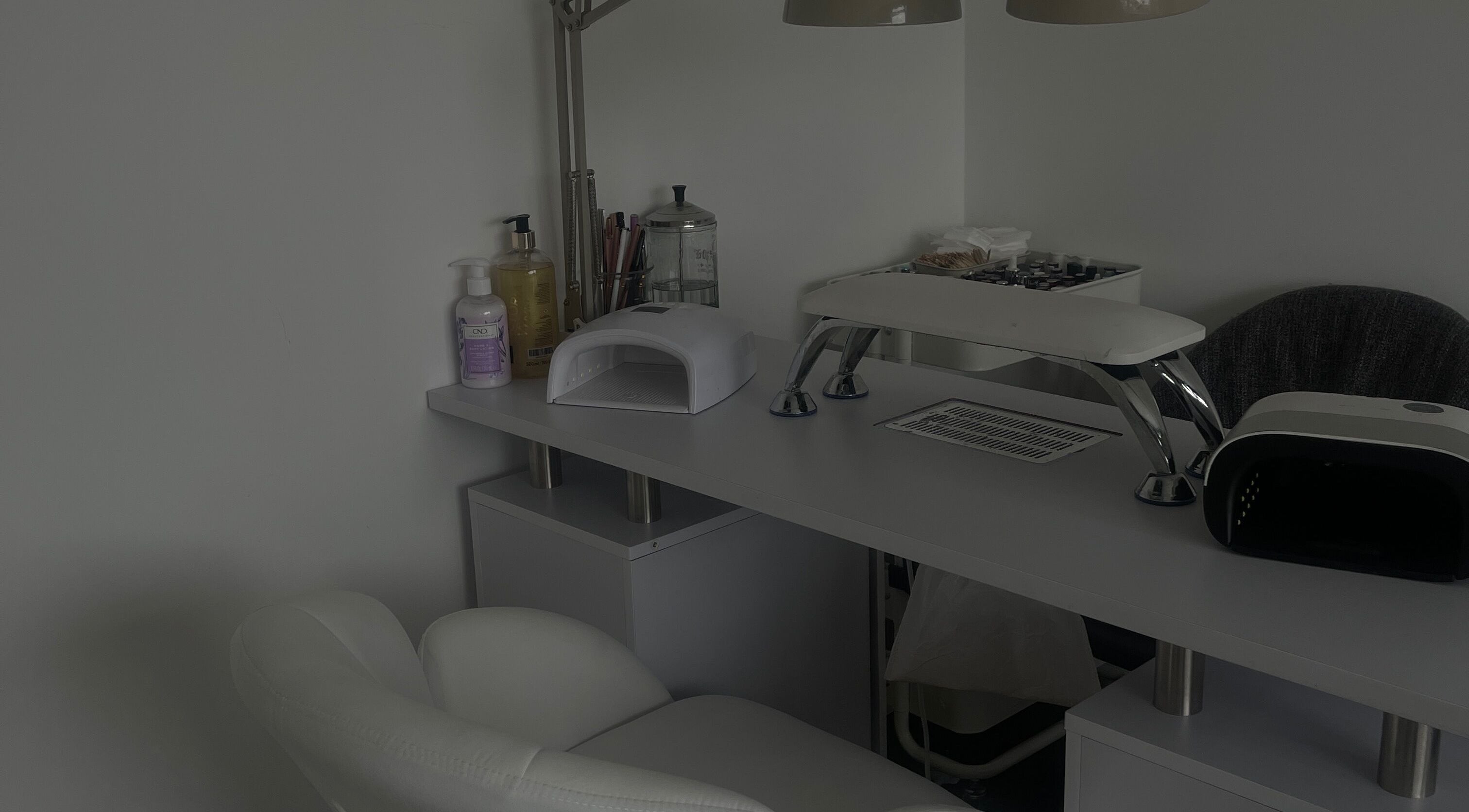 An elegant manicure station at Anas nails, London, England, GB featuring tools and a comfortable chair.