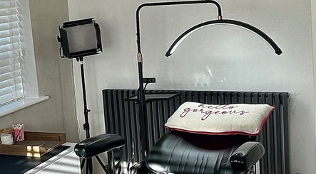 Beauty salon setup at El Emery Makeup & Beauty, ST21 6JU, England, GB with styling chair and cozy decor.