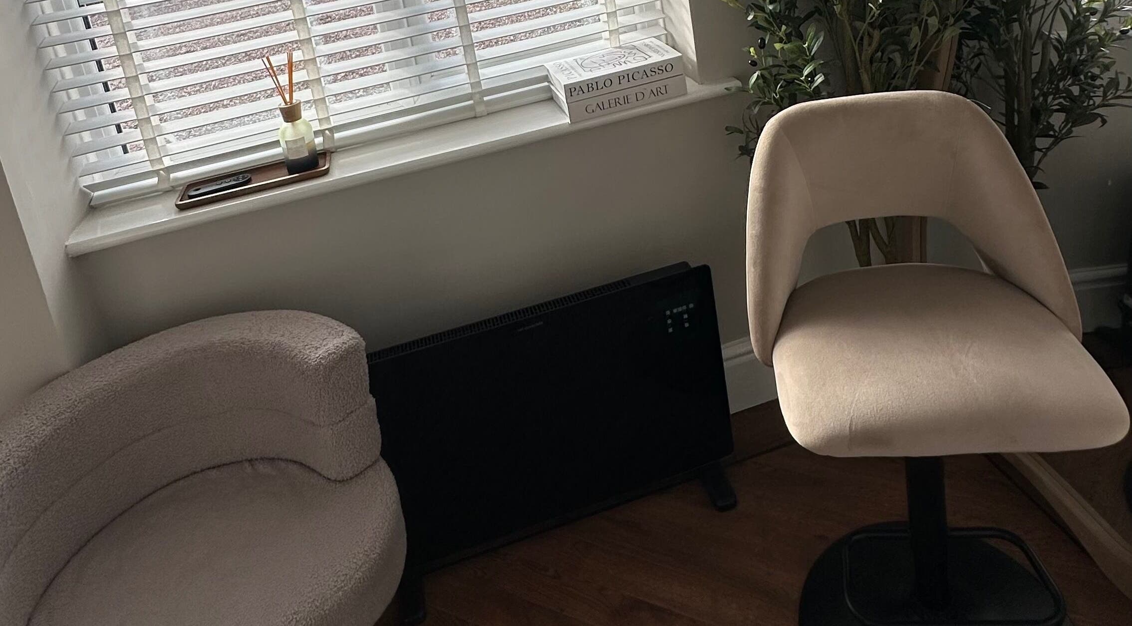 Elegant corner at El Emery Makeup & Beauty, ST21 6JU, England, GB with plush seating and modern décor.