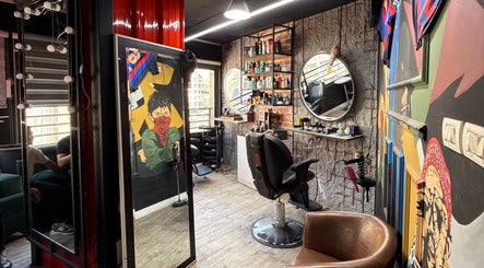 Abu Al Naser Salon in Nablus, IL boasts a trendy interior with artistic decor and modern barber chairs.