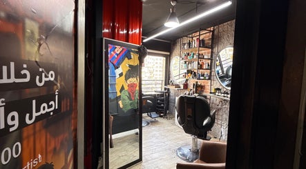Modern interior of Abu Al Naser Salon in Nablus, IL with stylish decor and barber chairs.