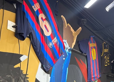 Abu Al Naser Salon in Nablus, IL, featuring sports jerseys decor on the wall.