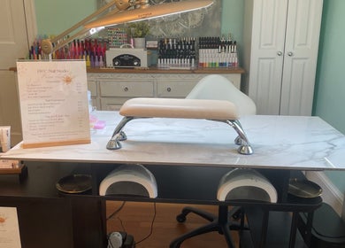 Manicure station at BEC Nail Studio LLC in Seaford, Delaware, US with tools and polish display.