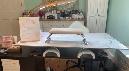 Manicure station at BEC Nail Studio LLC in Seaford, Delaware, US with tools and polish display.