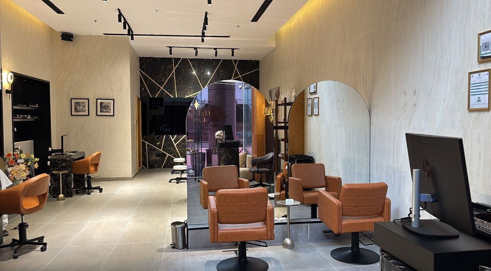 Elegant salon chairs and mirrors at Rawan Star Salon, Jeddah, Makkah Province, SA. Sophisticated décor and ambiance.