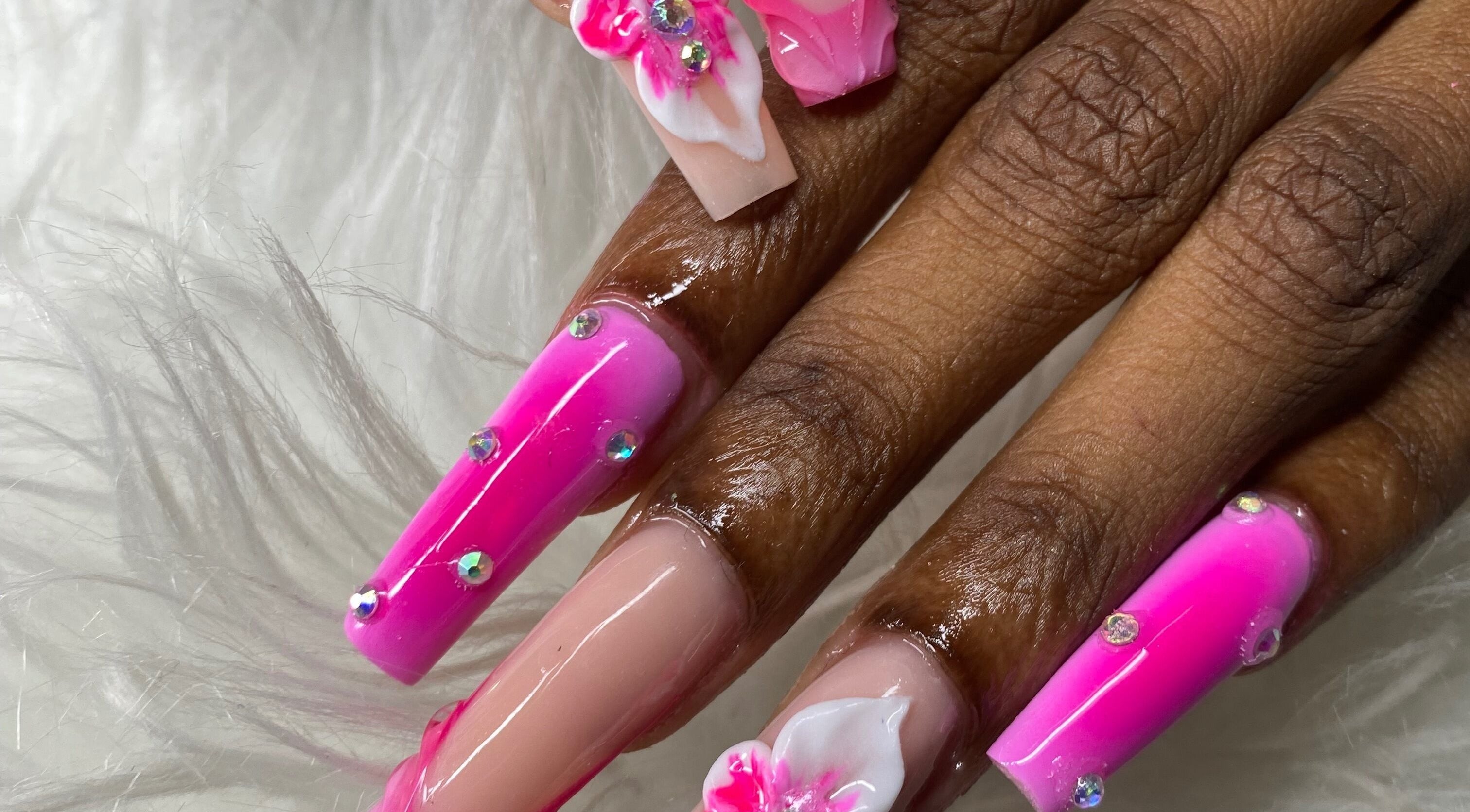 Elegant pink 3D floral nails at Beautiful Beginnings Nail Salon, Kingstown, VC.