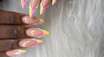 Colorful nails with pink and yellow tips at Beautiful Beginnings Nail Salon, Kingstown, VC.