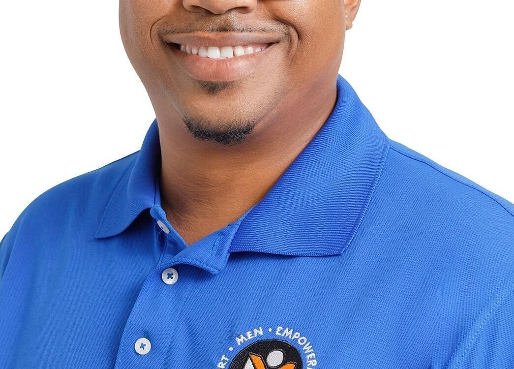 Person in a blue polo with Men Empowerment Network Support logo, Bridgetown, Saint Michael, BB.