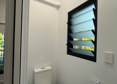 Modern restroom at The 2nd Chance Manual Therapy, Bayview, Northern Territory, AU featuring leafy window view.