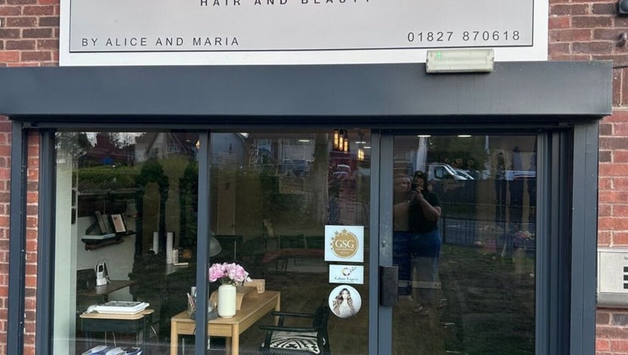 Front view of Harry’s Cutz in Kingsbury, England, GB showcasing its inviting salon entrance.