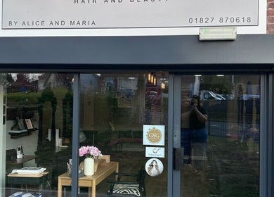 Front view of Harry’s Cutz in Kingsbury, England, GB showcasing its inviting salon entrance.
