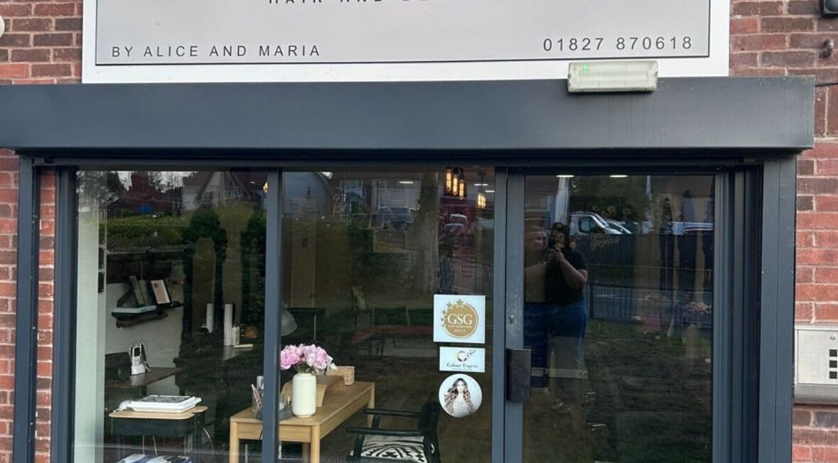 Front view of Harry’s Cutz in Kingsbury, England, GB showcasing its inviting salon entrance.