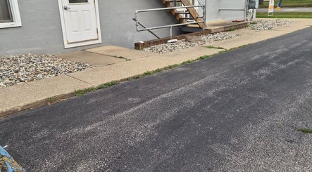 Modern entranceway at Star Child Esthetics LLC in Midland, Michigan, US featuring sleek concrete path.