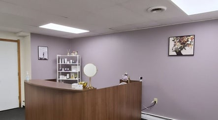Welcoming reception at Star Child Esthetics LLC in Midland, Michigan, US with calming purple walls.