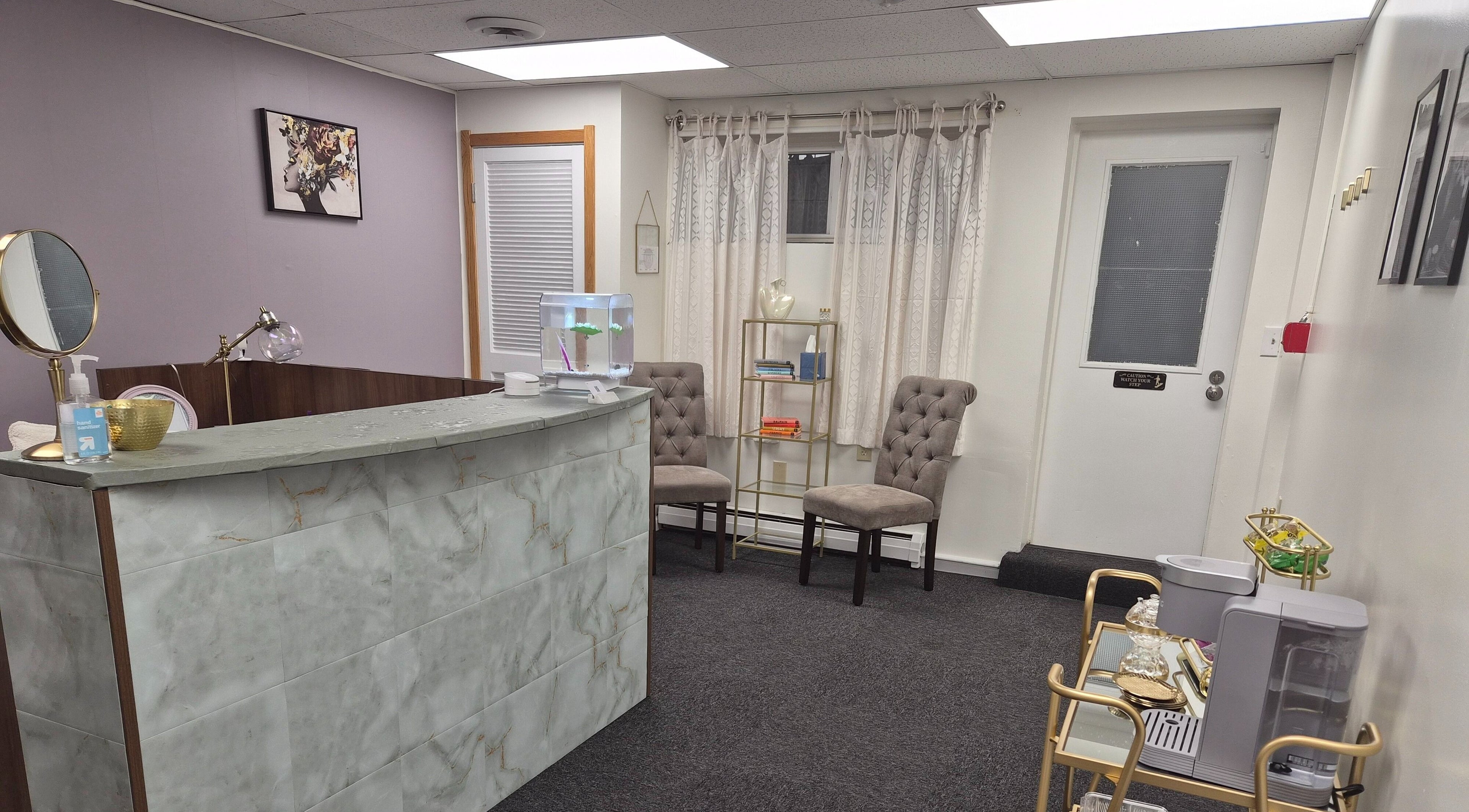 Elegant reception area of Star Child Esthetics LLC in Midland, Michigan, US featuring modern decor and seating.