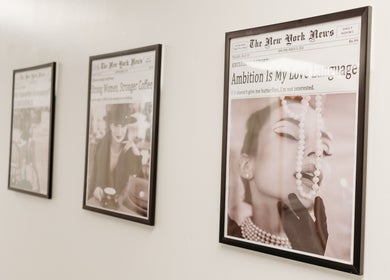 Chic framed newspaper art on wall at Star Child Esthetics LLC, Midland, Michigan, US.