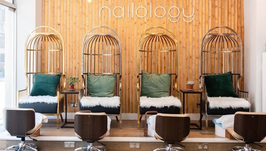 Luxurious seating area at Newelle Beauty, London, England, GB featuring plush chairs and stylish decor.