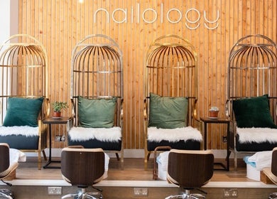 Luxurious seating area at Newelle Beauty, London, England, GB featuring plush chairs and stylish decor.