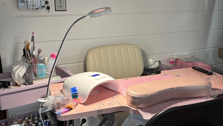 Nail station at KT Nails and Esthetics in Lynn, Massachusetts, US, equipped with tools for professional nail care.
