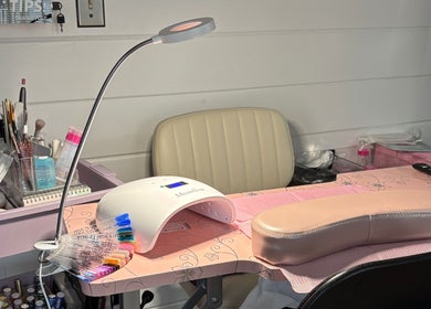 Nail station at KT Nails and Esthetics in Lynn, Massachusetts, US, equipped with tools for professional nail care.