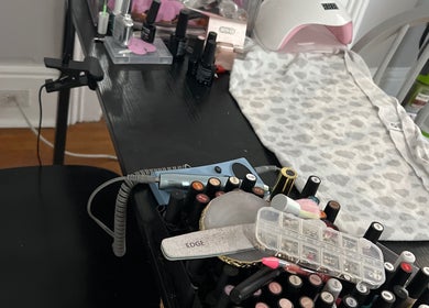 Nail tools and polishes at Sheeniquebnails in St. Catharines, Ontario, CA, showcasing a professional spa setup.