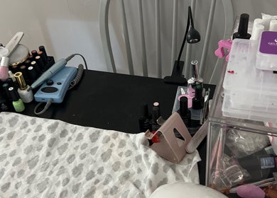 Nail tools and polishes on a desk at Sheeniquebnails, St. Catharines, Ontario, CA.