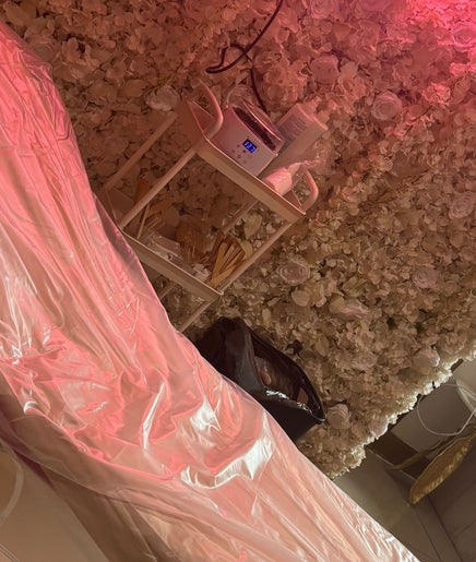 Relaxing spa room with pink therapy bed at Minnie's, Birstall, England, GB.