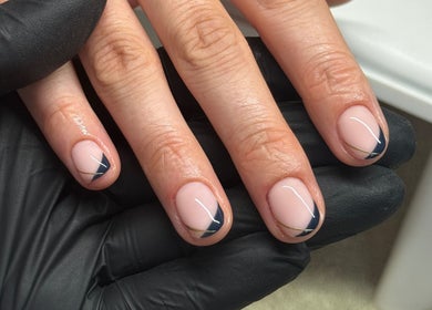 Elegant, minimalist nail design at Bydeedeelayy in Horsmonden, England, GB featuring black gloves.