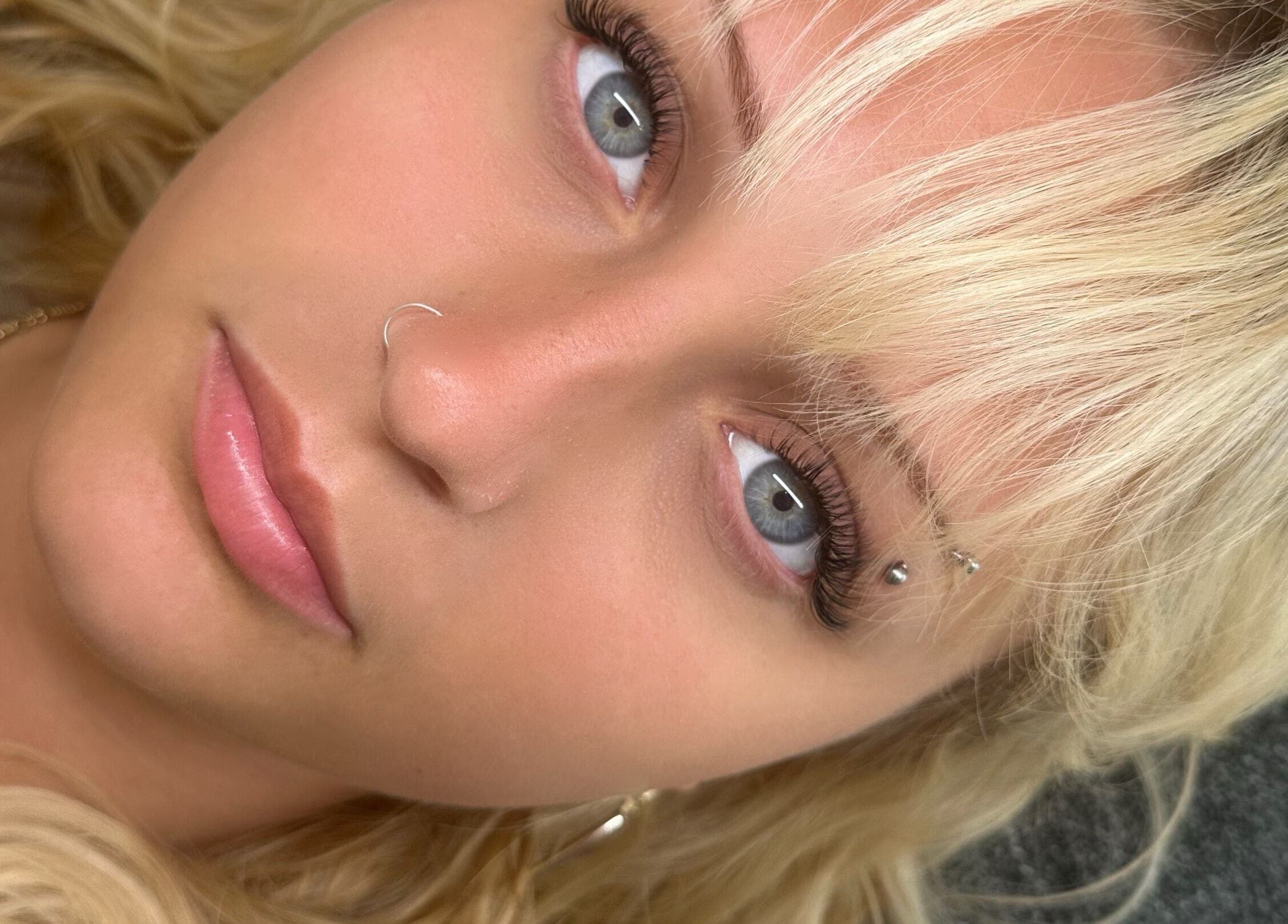 Close-up of a blonde woman with nose ring at Paloma House Sandbanks, Poole, England, GB.