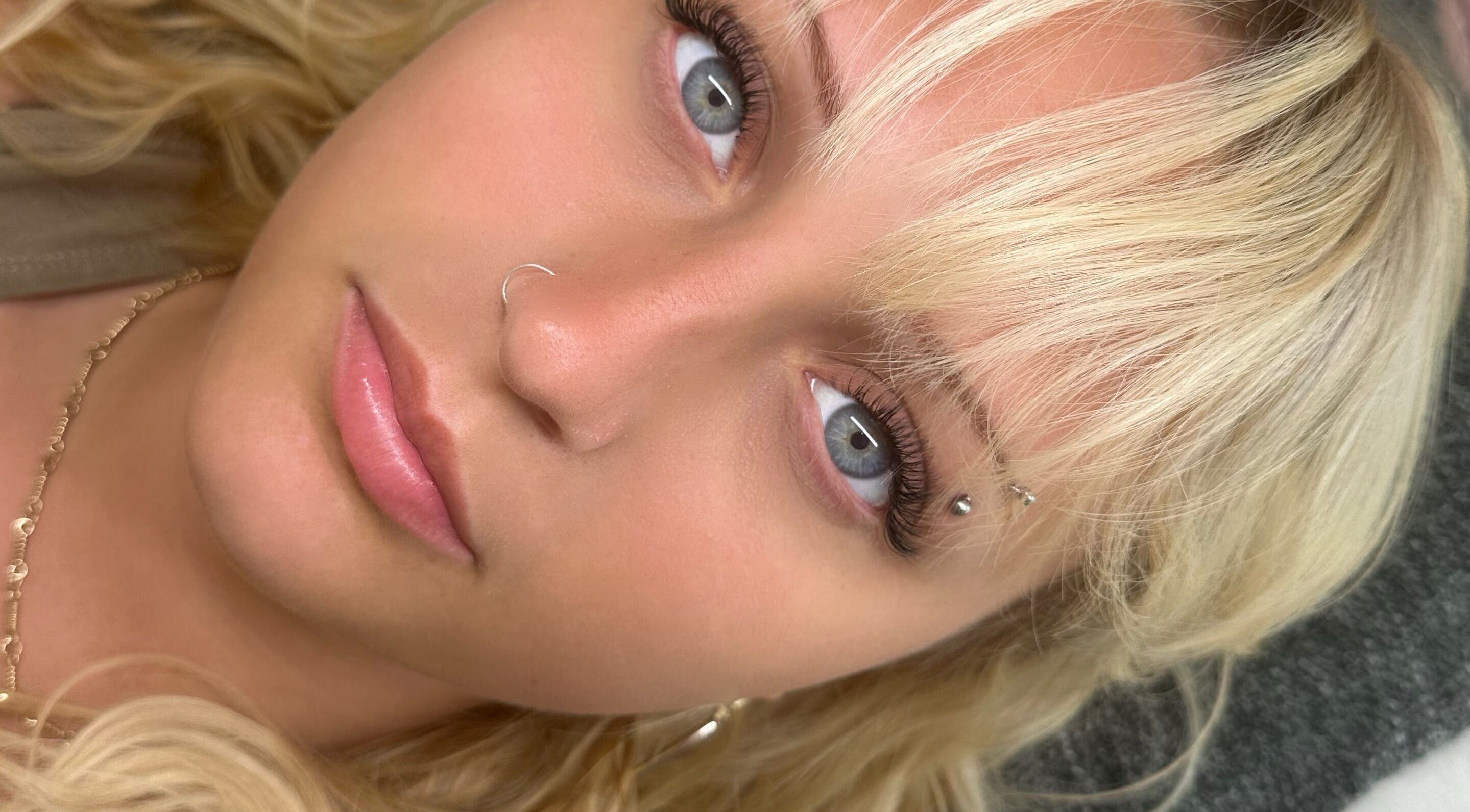 Close-up of a blonde woman with nose ring at Paloma House Sandbanks, Poole, England, GB.