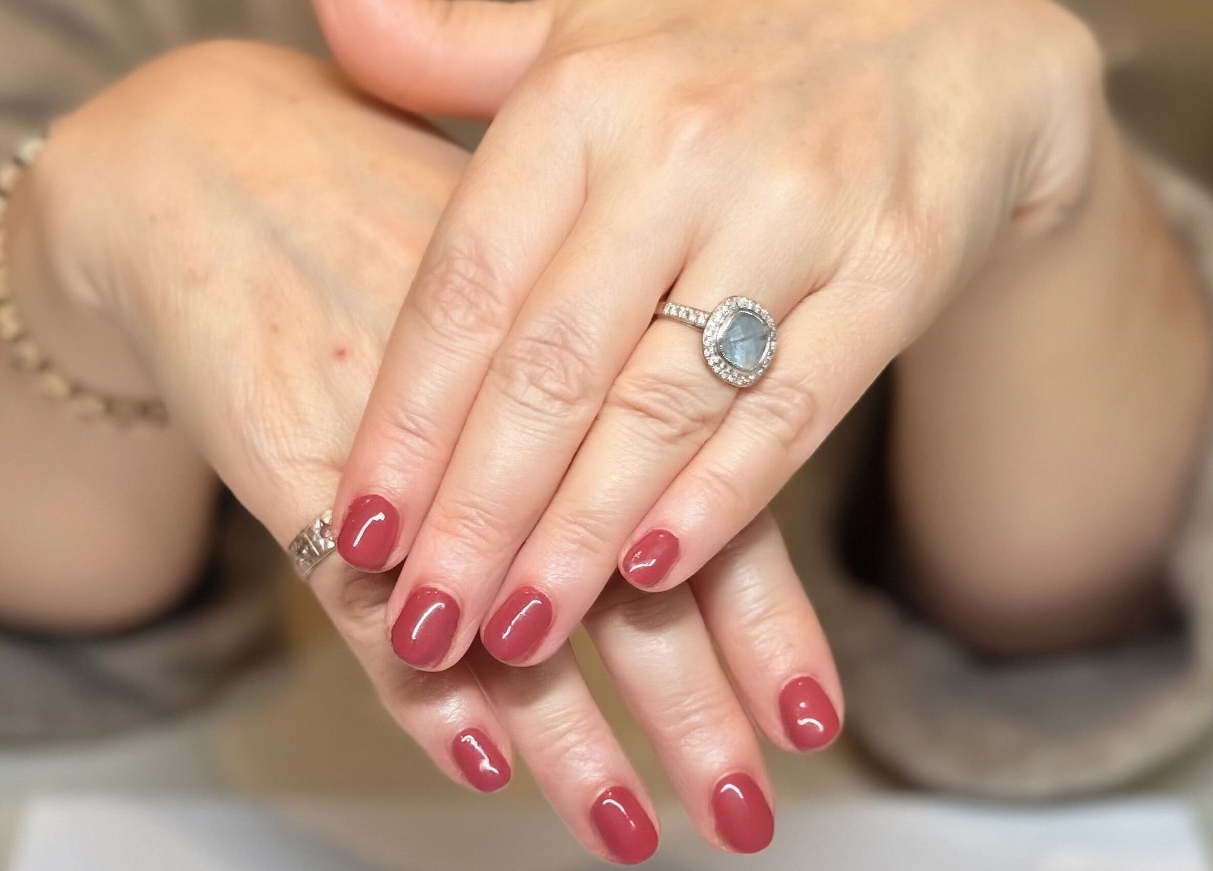 Polished nails with rings at Paloma House Sandbanks in Poole, England, GB showing refined beauty.