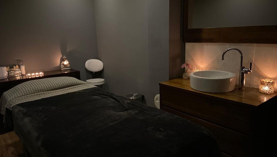 Cozy treatment room at Fairy Tale Therapies Ltd, Edinburgh, Scotland, GB with soft candle lighting.