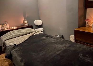 A tranquil massage room at Fairy Tale Therapies Ltd, Edinburgh, Scotland, GB, with soft lighting and cozy ambiance.