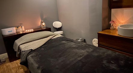 A tranquil massage room at Fairy Tale Therapies Ltd, Edinburgh, Scotland, GB, with soft lighting and cozy ambiance.