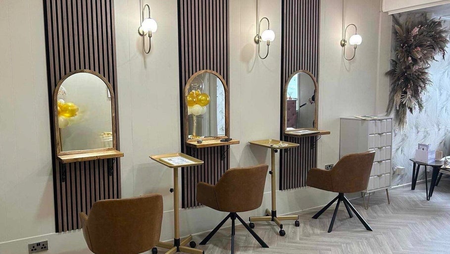 Modern styling stations at Salon 42, Wombwell, England, GB featuring elegant mirrors and seating.