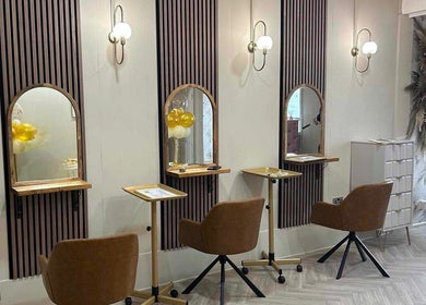 Modern styling stations at Salon 42, Wombwell, England, GB featuring elegant mirrors and seating.