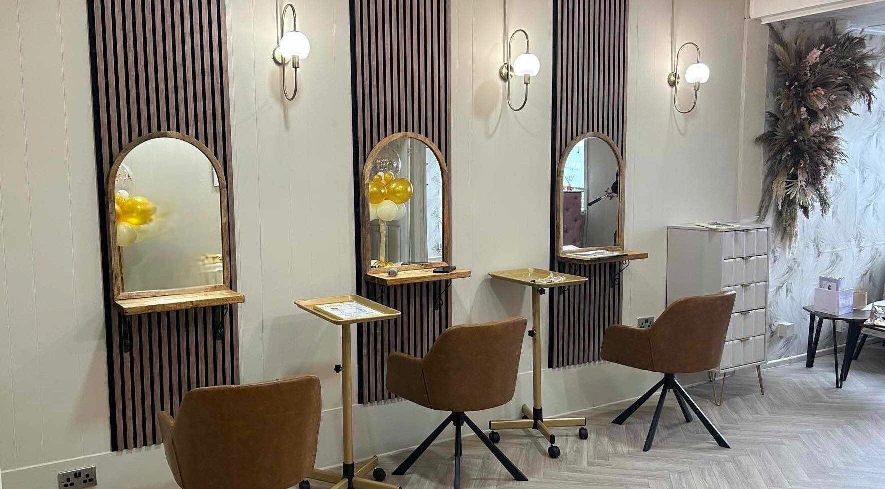 Modern styling stations at Salon 42, Wombwell, England, GB featuring elegant mirrors and seating.