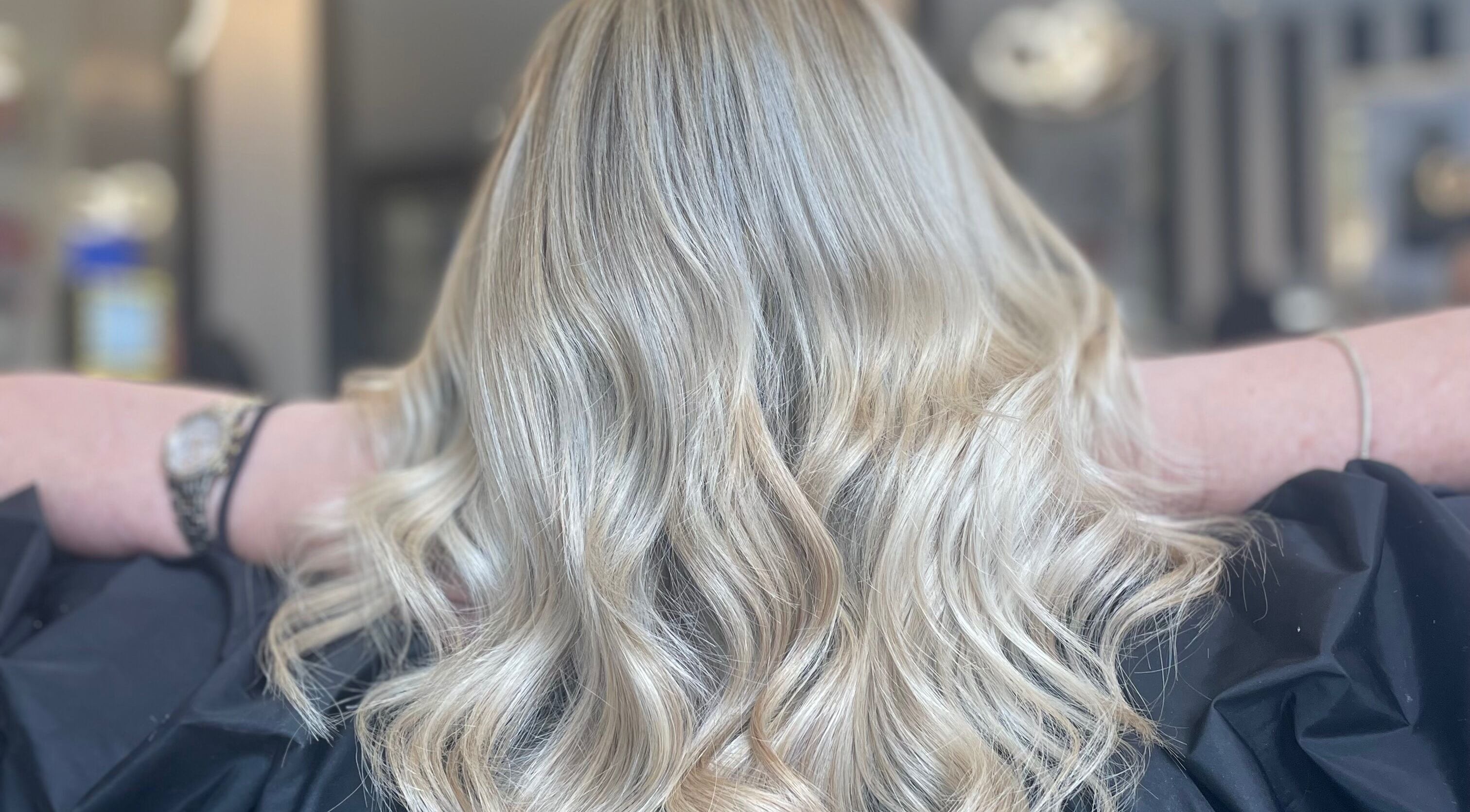 Voluminous blonde curls styled at Hair by Paige in Tyldesley, England, GB for a stunning appearance.