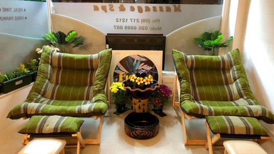 Relaxing seating at Eden Thai Massage & Spa - Mount Eden, Auckland, NZ with lush greenery and soothing decor.