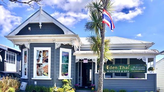Eden Thai Massage & Spa - Kingsland in Auckland, NZ. Elegant grey exterior with palm and flag, inviting ambiance.
