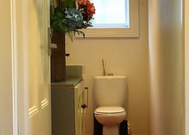 Elegant restroom at Eden Thai Massage & Spa - Kingsland, Auckland, NZ, featuring floral decor for a tranquil ambiance.