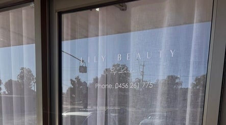 Entrance of Lily Beauty by Leila in Buronga, New South Wales, with elegant window sign.