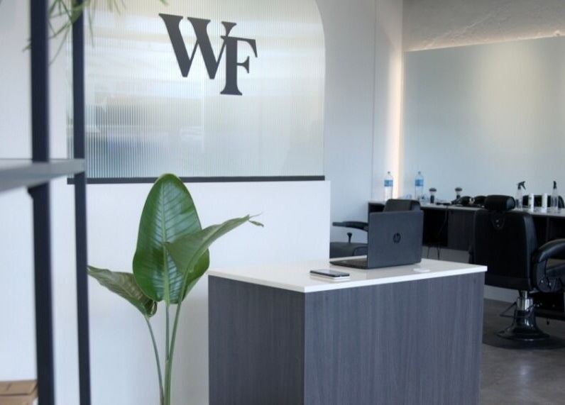 Modern interior of Whistle & Flute Barber Studio in Auckland, Auckland, NZ showcasing sleek reception area.