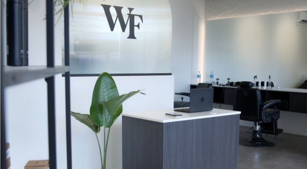 Modern interior of Whistle & Flute Barber Studio in Auckland, Auckland, NZ showcasing sleek reception area.