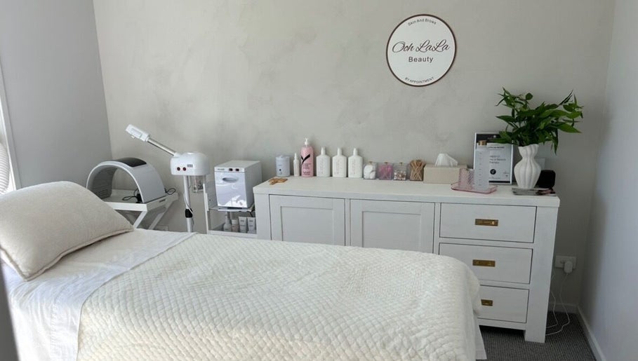 Calming treatment room at Ooh Lala Beauty, Redland Bay, Queensland, AU featuring a plush bed and aesthetic decor.