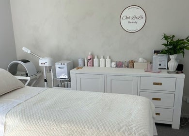 Calming treatment room at Ooh Lala Beauty, Redland Bay, Queensland, AU featuring a plush bed and aesthetic decor.